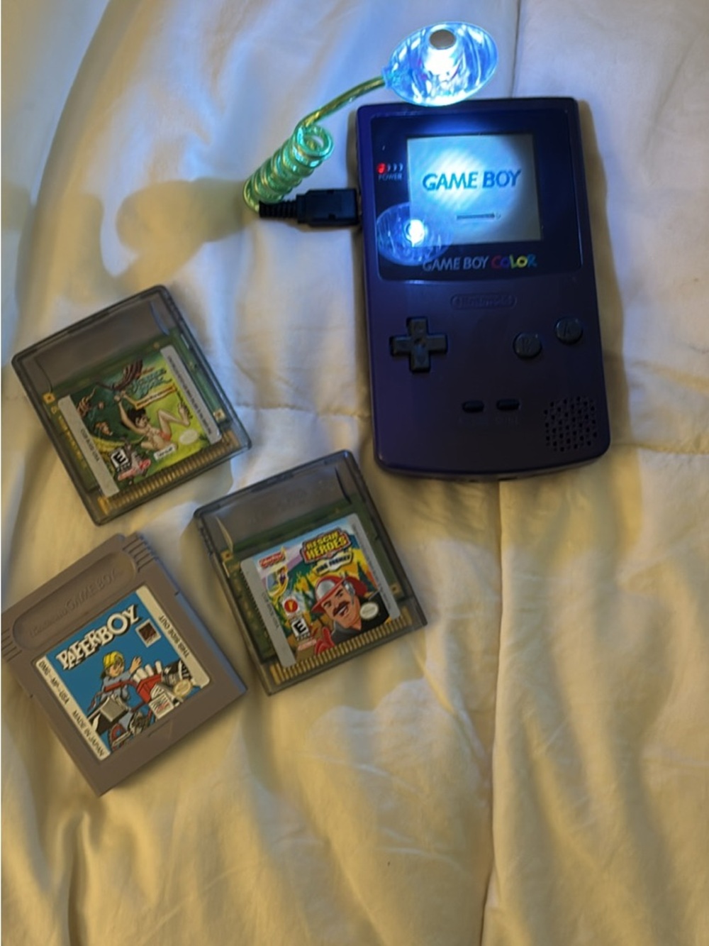Nintendo Game Boy Color in Purple with Three Game Cartridges and Light